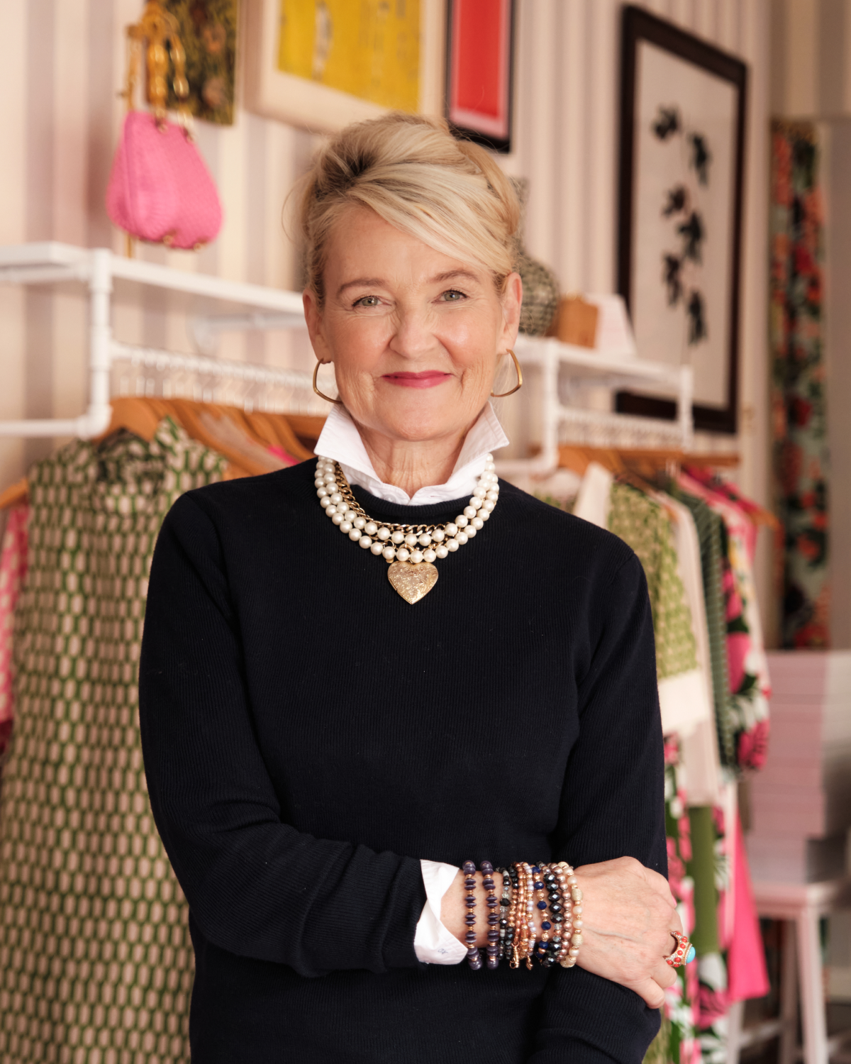 Woman in a black sweater with jewelry in a store setting